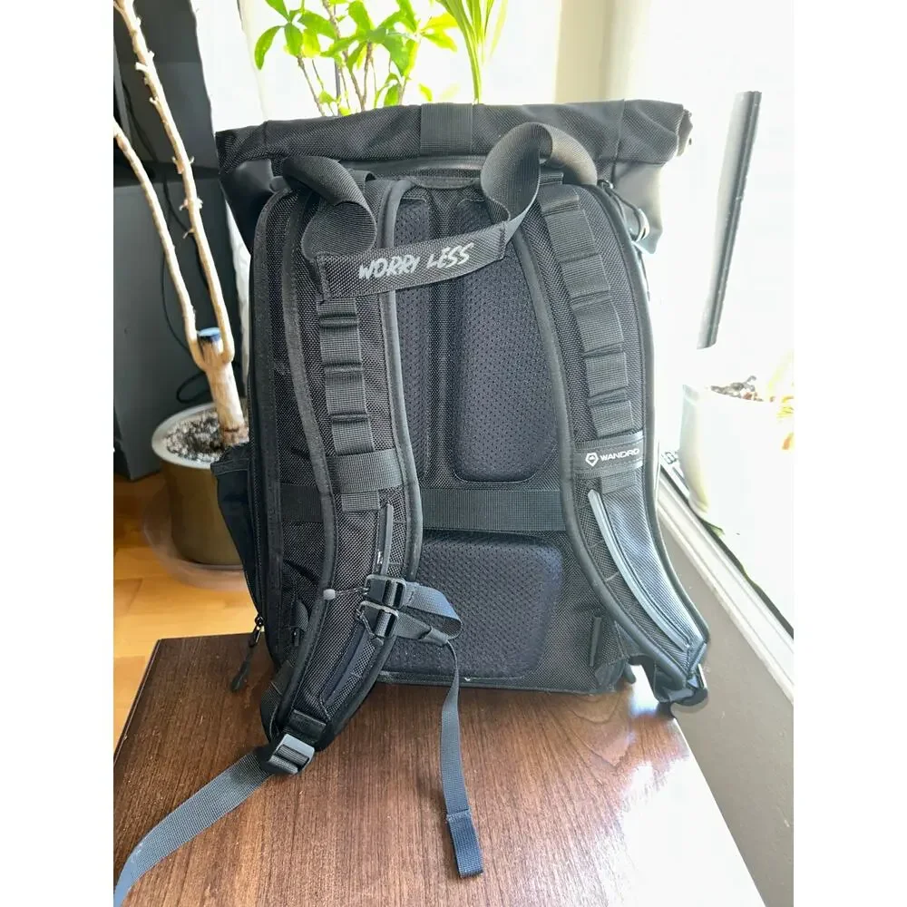 WANDRD PRVKE Lite travel camera backpack black roll-top closure magnetic handles